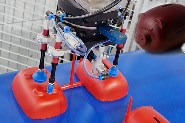 Automated Piggy Bank Removal from Injection Molding